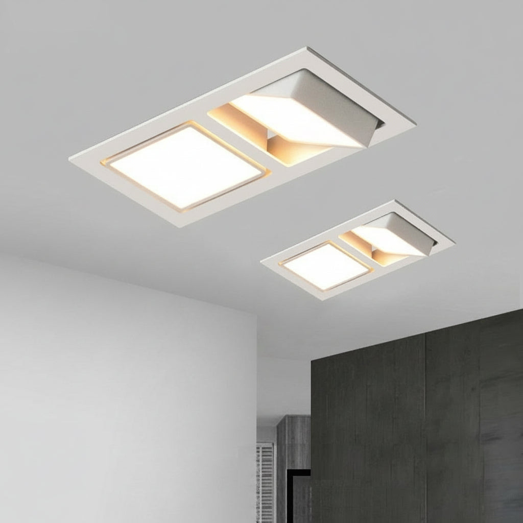 Square recessed LED downlights installed in a ceiling, providing illumination in a room with a modern aesthetic.