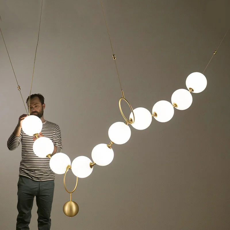 Modern creative staircase long pendant light Nordic light luxury restaurant clothing store showcase bar counter round light