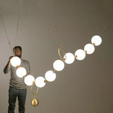 Modern creative staircase long pendant light Nordic light luxury restaurant clothing store showcase bar counter round light