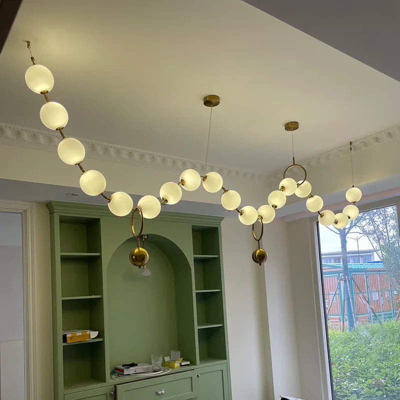 Modern creative staircase long pendant light Nordic light luxury restaurant clothing store showcase bar counter round light
